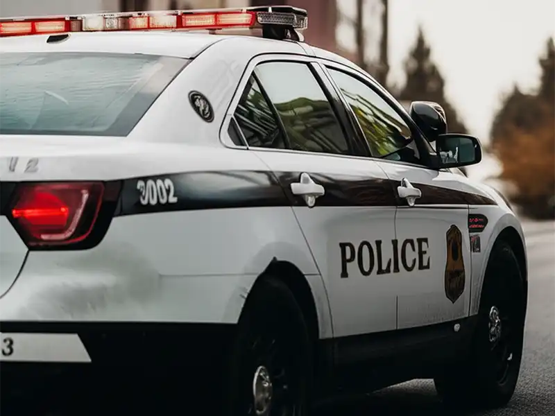 Police car cruising downtown Olympia, WA for criminal acticvity